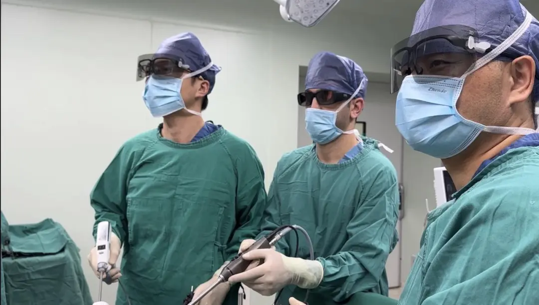 Multidisciplinary surgical team performing laparoscopic colorectal cancer surgery
